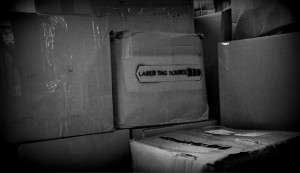 cardboard boxes stacked with logo painted on side