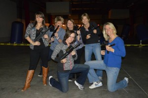 girls holding tippmann laser tag guns